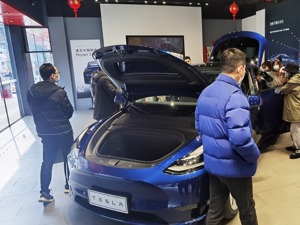 营收利润“双杀”预期，去年净赚850亿元！特斯拉大涨近11%，重回5000亿美元